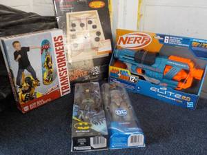 lot 138 image: Nerf, Puck Battle, Transformers Bag and DC Figures- new in box