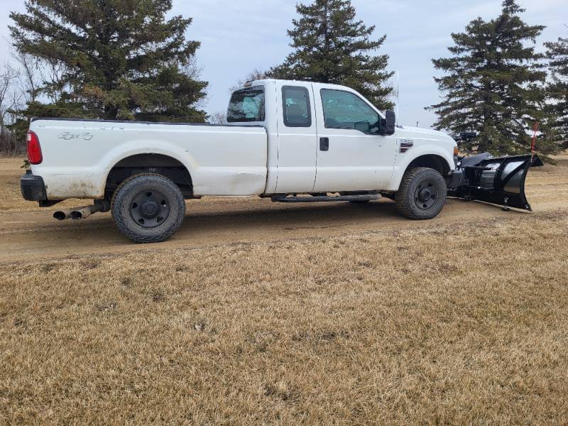 2009 Ford F250 Powerstroke with Nearly New Boss 8 2 XT Stainless Plow