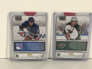 lot 24 image: 2 - 2013-14 Fabric of the Game Hockey Cards
