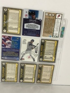 lot 38 image: Lot of 9 Baseball Cards - Derek Jeter - Reggie Jackson - Ron Jones Rookie - 2 different Tug McGraw Cards from the Same Year but Carry the Same Card Number & More