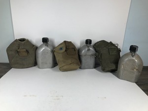 lot 76 image: 3 - Vintage Military Canteens with Carrying Pouches - All of the Canteens say U.S. AGM Co. 1945