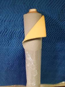 lot 341 image: Partial roll of tan with foam backing upholstery material