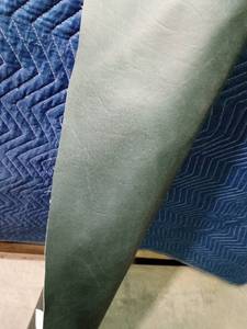 lot 322 image: Partial roll of green vinyl upholstery material