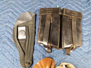 lot 282 image: 1989 Police military ammo belt case and 3 sm pistol holsters 