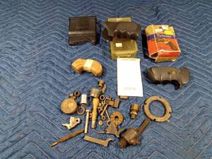 lot 278 image: 3 Handgun grips, clip, and gun parts