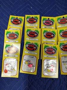 lot 231 image: Flat of fishing spinners and harnesses new in package