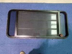 lot 239 image: Camper window with crank out triple window with screen