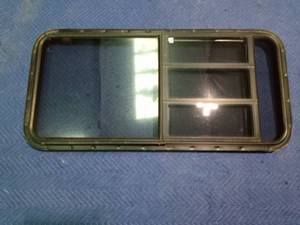 lot 240 image: Camper window with flip open window on 1 side and triple crank out window on other side