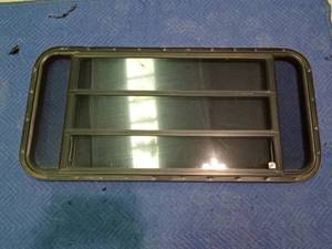 lot 236 image: Camper window with crank out triple window with screen