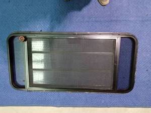 lot 238 image: Camper window with crank out triple window with screen