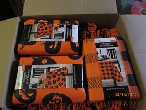 lot 90 image: box of hallowen table cloths...