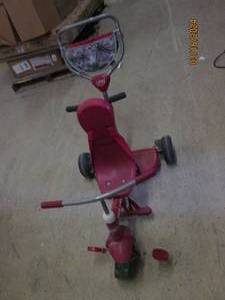 lot 94 image: radio flyer 3 wheeled bike with push bar front wheel needs to be put back on