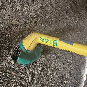 Electric weed whip, by weed eater.