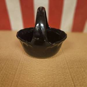 Black basket with foral design.