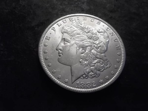 lot 8 image: 1882 CC Morgan Silver Dollar