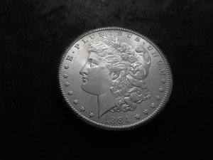 lot 14 image: 1884 CC Morgan Silver Dollar
