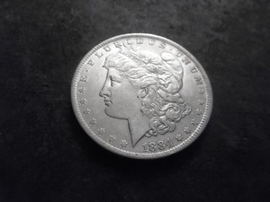 lot 15 image: 1884 O Morgan Silver Dollar