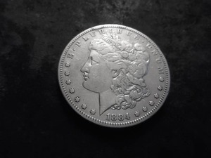 lot 16 image: 1884 S Morgan Silver Dollar