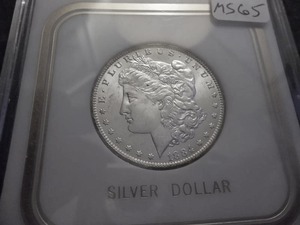 lot 17 image: 1884 O Morgan Silver Dollar