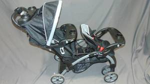 lot 52 image: Baby Trend Sit N Stand Convertible Multi-Use Easy Fold Travel Toddler and Baby Double Stroller with Safety Harness and Storage Basket, Stormy