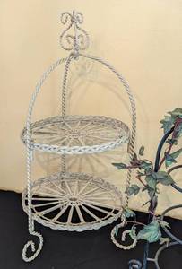 lot 102 image: Three Metal Plate Display Stands