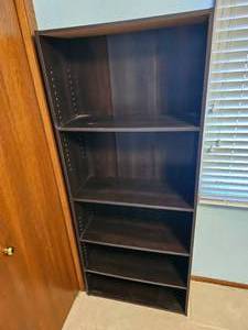 lot 29 image: Sleek Black Bookcase