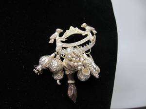 lot 68 image: Sterling Silver Hindu Style Cluster Brooch