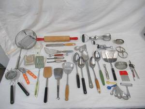lot 23 image: Lot of Vintage Baking, Serving & Cutting Utensils, Strainers, Rolling Pin, Beaters, and more.