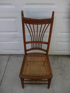 lot 37 image: Vintage Oak DinetteOccasional Chair with cane seat.
