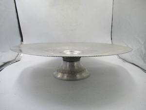 lot 47 image: Vintage hammered aluminum lazy Suzan pedestal tray.