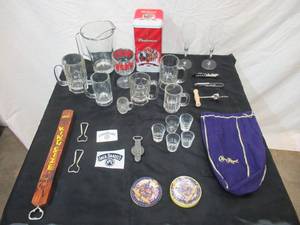 lot 91 image: Vintage Lot of Barware Beer Mugs, Pitcher, Shot Glasses, Wine Glasses, Coasters, openers and more.