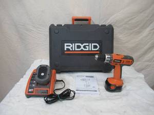 lot 103 image: Rigid Drill with Instructions, 2 Batteries and Charger in case.