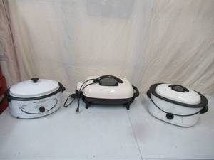 lot 157 image: Lot of 3 Cookers Rival Electric Skillet, Rival 8 Qt. Electric Roaster Oven, Nesco 6 Qt. Electric Roaster Oven.
