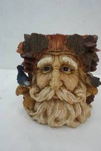 lot 82 image: Planter with a man face coming out of the tree