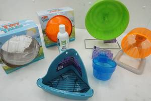 lot 152 image: Hamster Supplies Green Exercise Wheel, Orange Exercise Wheel, Food Bowl and more