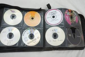 lot 531 image: Large Variety of CDs & Black Storage Case 50 Cent, Inner Peace, Usher, Little Wayne and more
