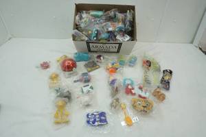 lot 594 image: Lot of Small Toys still in plastic, Disney Characters, Nickelodeon , Straws, Pezs and more