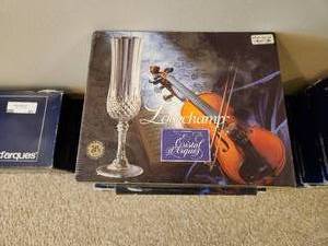 lot 92 image: 4 Boxes of 4 and 1 Box of 6 Longchamp Crystal Champagne Glasses