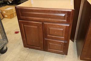 lot 211 image: Hampton Bay Wood Vanity Cabinet 1-door2-drawer 31x21x33-12 (New)
