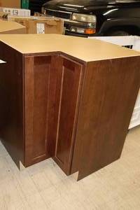 lot 210 image: Hampton Bay Wood Inside Corner Bi-Fold Door Cabinet 42-12x30x35 (New)