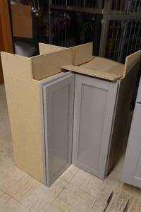 lot 221 image: Hampton Bay Inside Corner Bi-Fold Door Cabinet 35x28x34-12 (New)