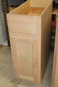 lot 228 image: Hampton Bay Cabinet Unfinished 1-door1-drawer 24x24x34-12 (New)