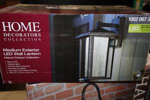lot 275 image: Home Decorators Collection Mauvo Canyon Collection Medium Exterior LED Wall Lantern Black Finish with Seeded Glass