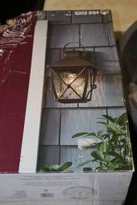lot 276 image: Home Decorators Collection Springbrook Medium Exterior Wall Lantern Rustic Finish with Clear Water Glass Shade