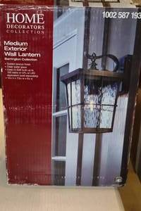 lot 282 image: Home Decorators Collection Barrington Collection Medium Exterior Wall Lantern Golden Bronze Finish with Clear Water Glass Shade