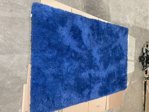 lot 342 image: Blue Fluffy Area Rug Measures 91 x 65