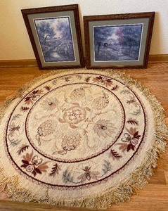 Round fringed rug and pair of matching framed pictures