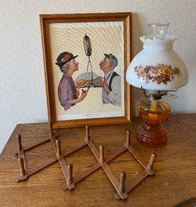 Oil lamp with Hurricane Shade, Norman Rockwell Tipping the Scales framed print