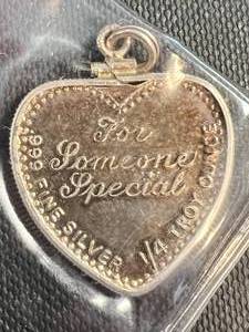 lot 57 image:  TROY OZ .999 FINE SILVER FOR SOMEONE SPECIAL HEART SHAPED BAR