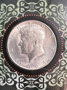 lot 101 image: 1964 US KENNEDY HALF DOLLAR IN INFO. BOOK